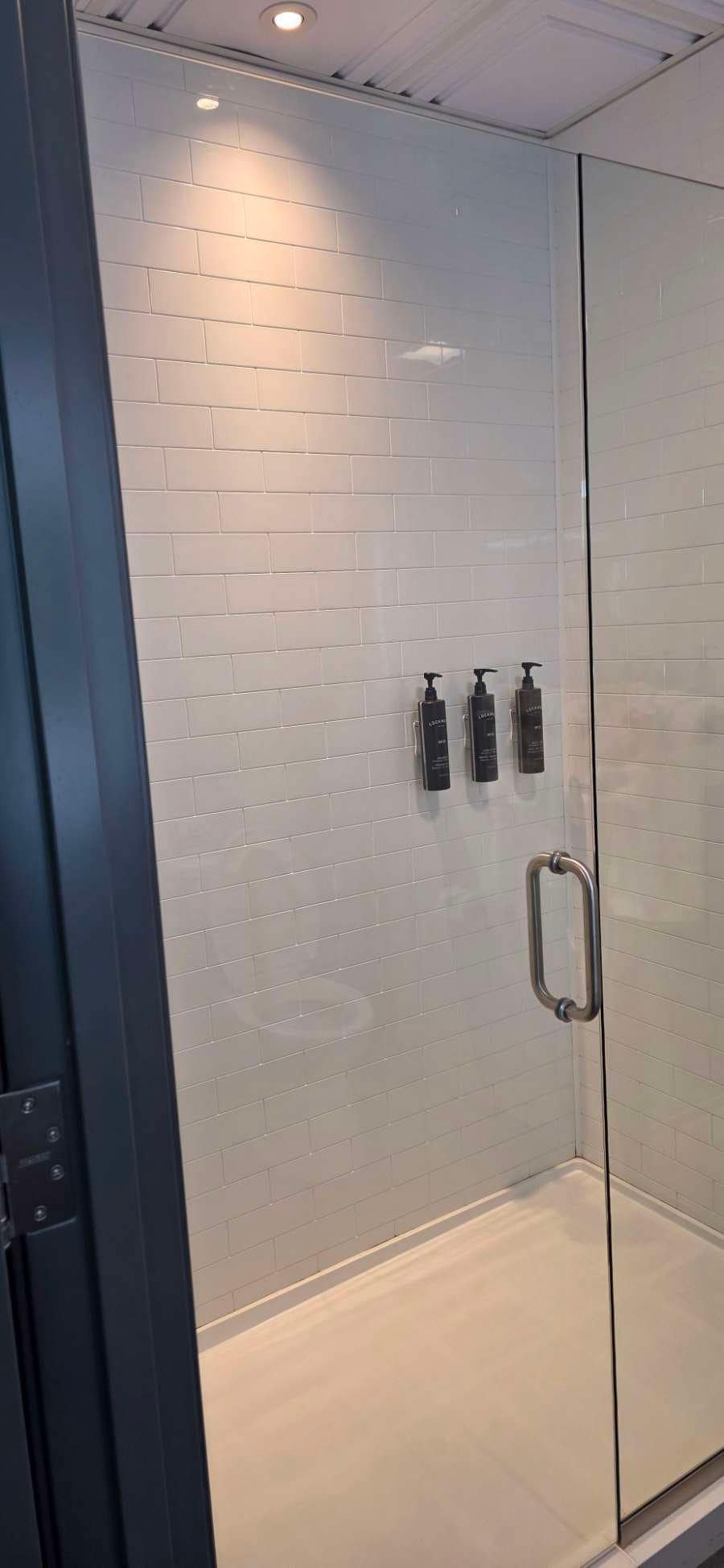 Shower was roomy and temperature was hot enough. Does leak at the bottom though. 