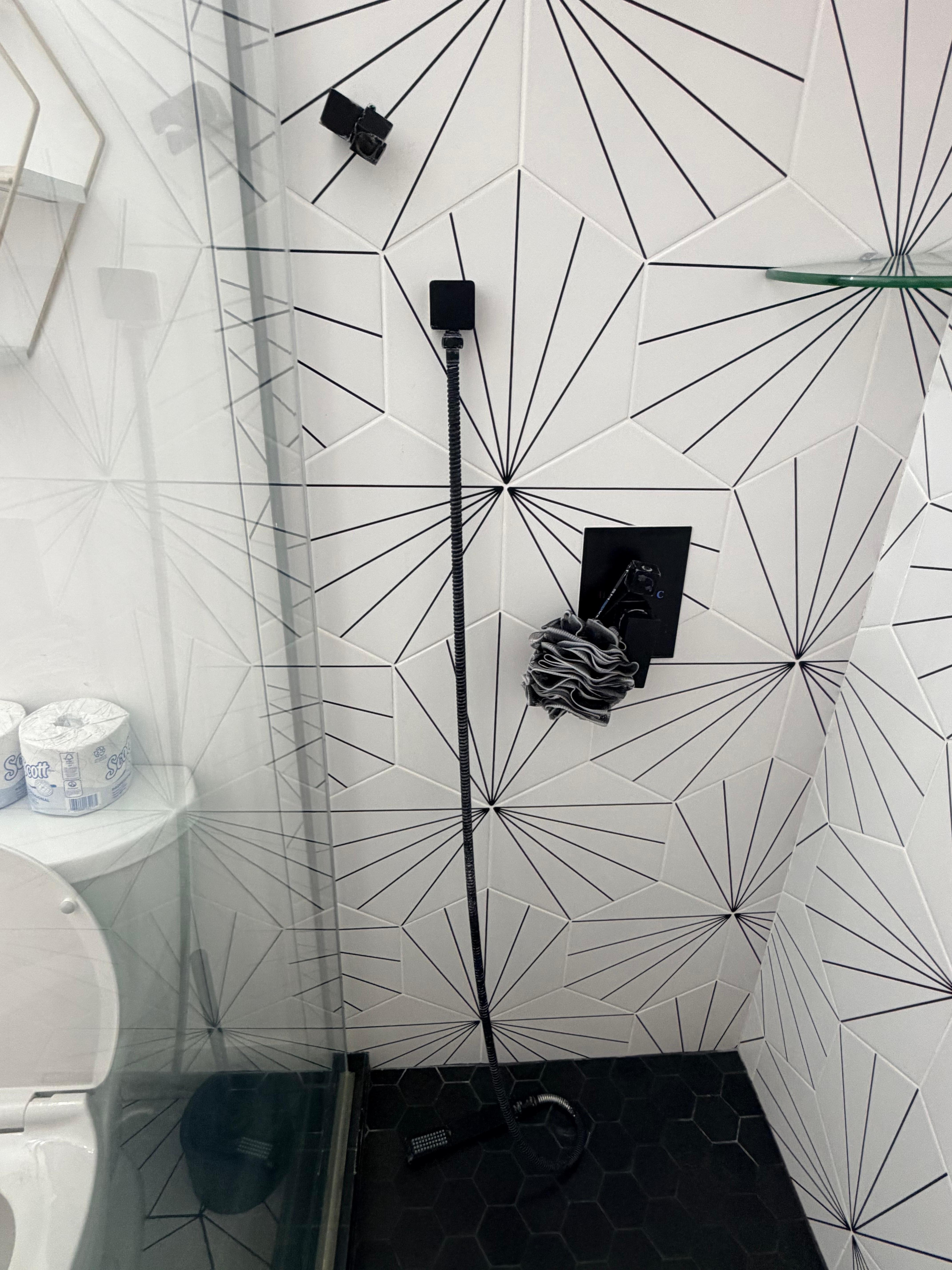 Hand held shower unable to be hung or used in normal fashion 