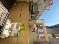 Outside building and where to find-drop key, and tel. (+66) 6-3184-4107