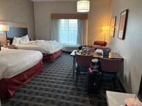 2 queen beds, dining table, and a nice corner to curl up and read.