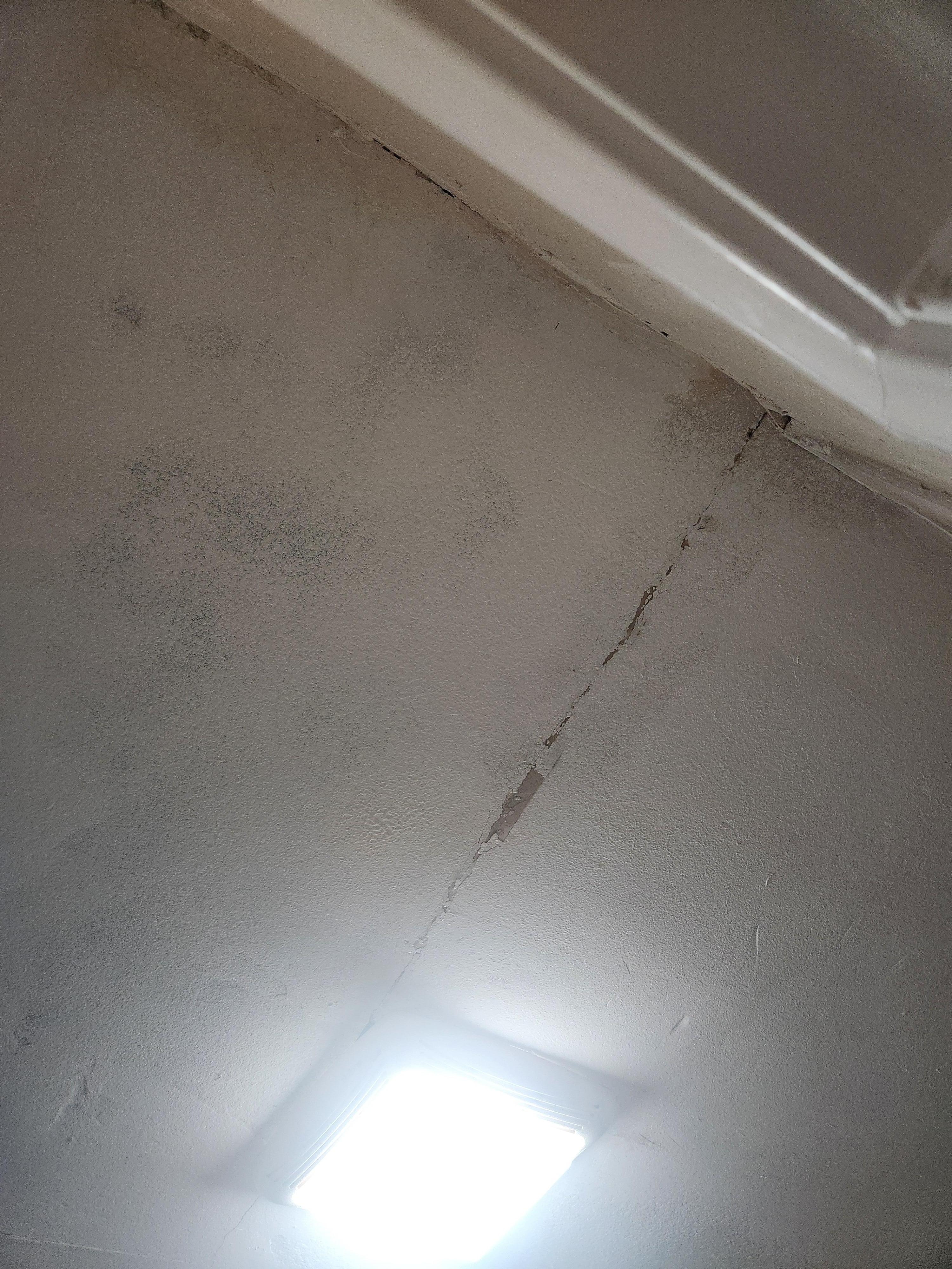 Damage where water splashes from above neighbor