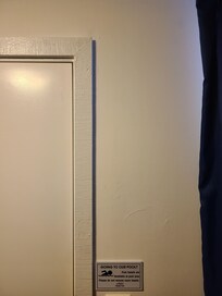 Very odd choice of door and window trim, to save money