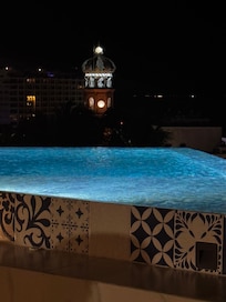 Nighttime at the pool, overlooking The church of Our Lady of Guadalupe.