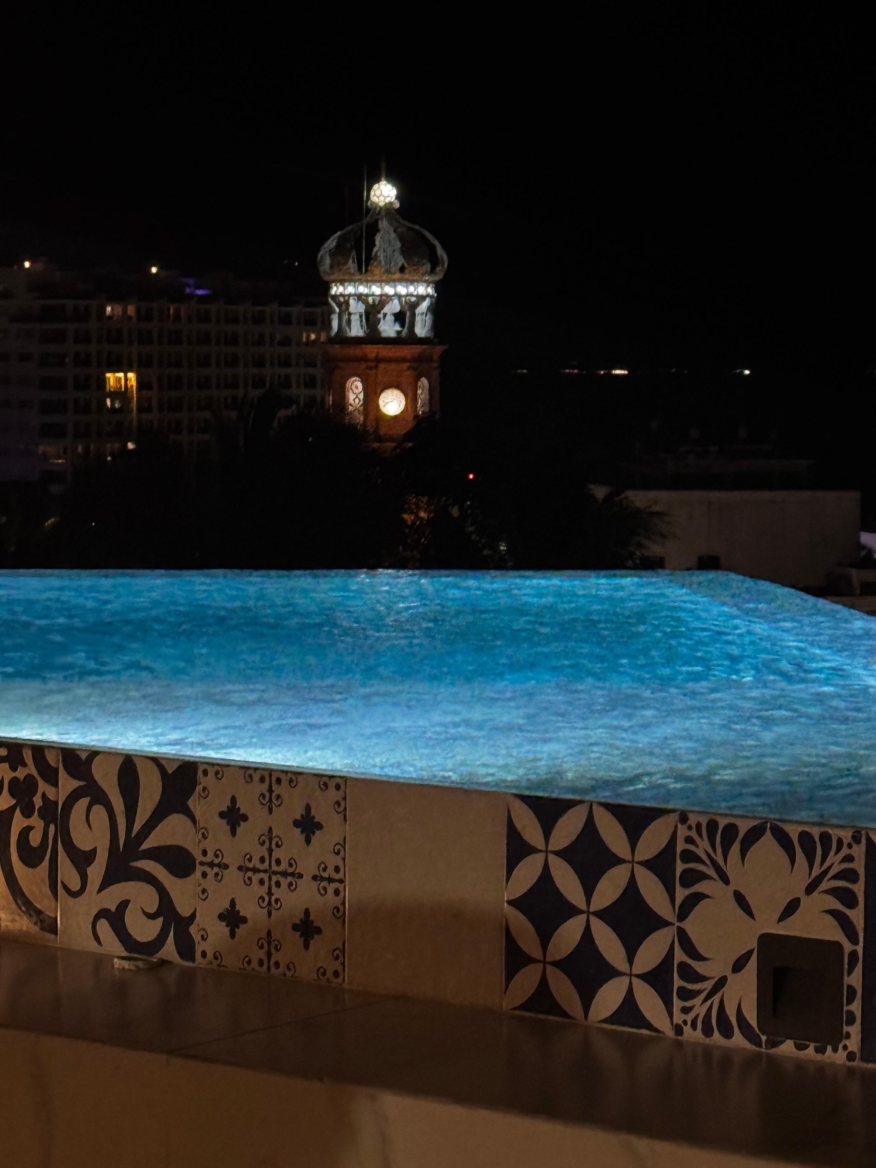 Nighttime at the pool, overlooking The church of Our Lady of Guadalupe. 