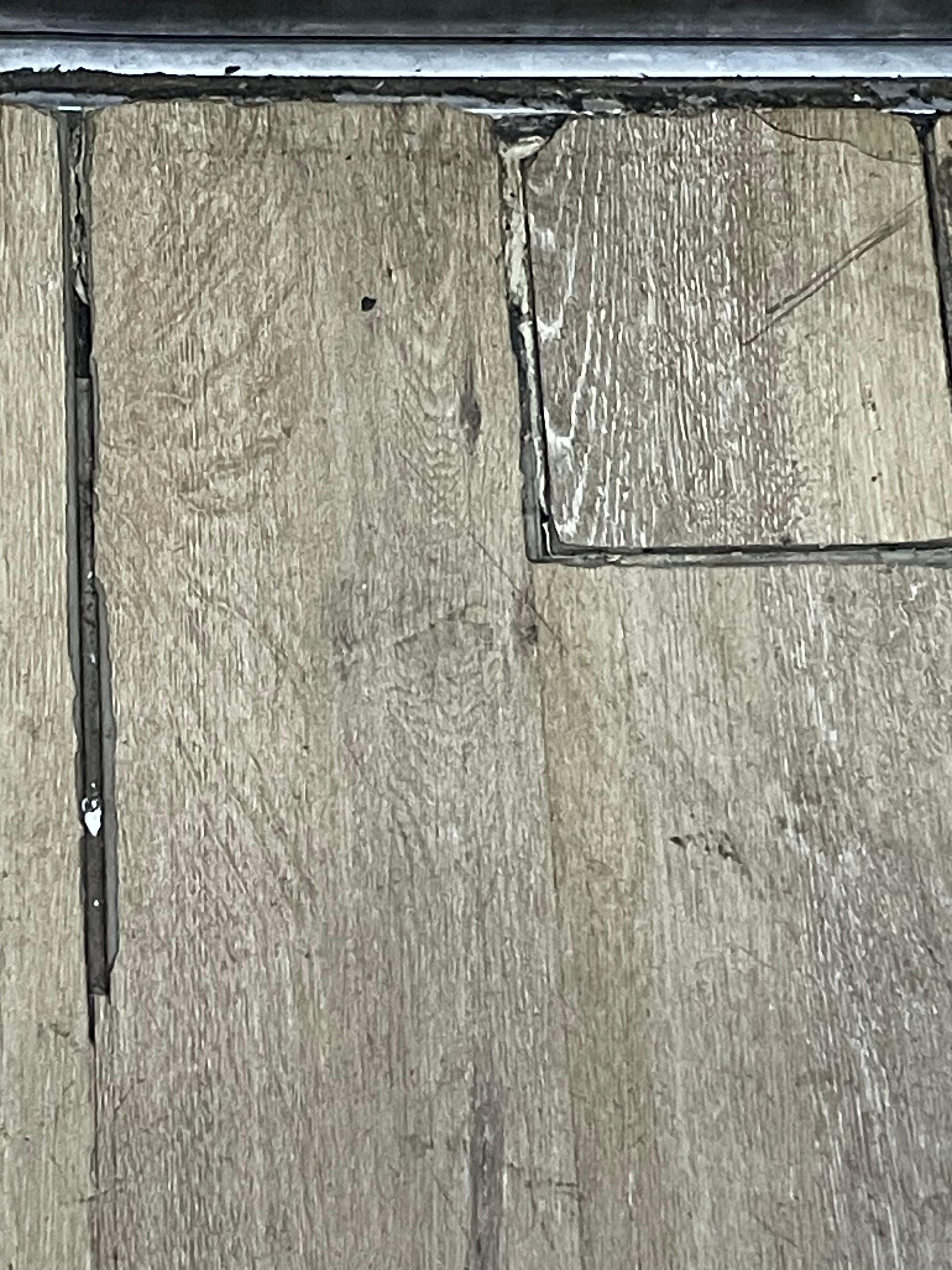 Elevator floor, dirty and missing grout