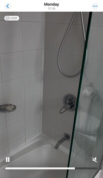 Broken old fashioned shower arrangement. Bath spout ran at the same time as the shower resulting in poor water pressure.