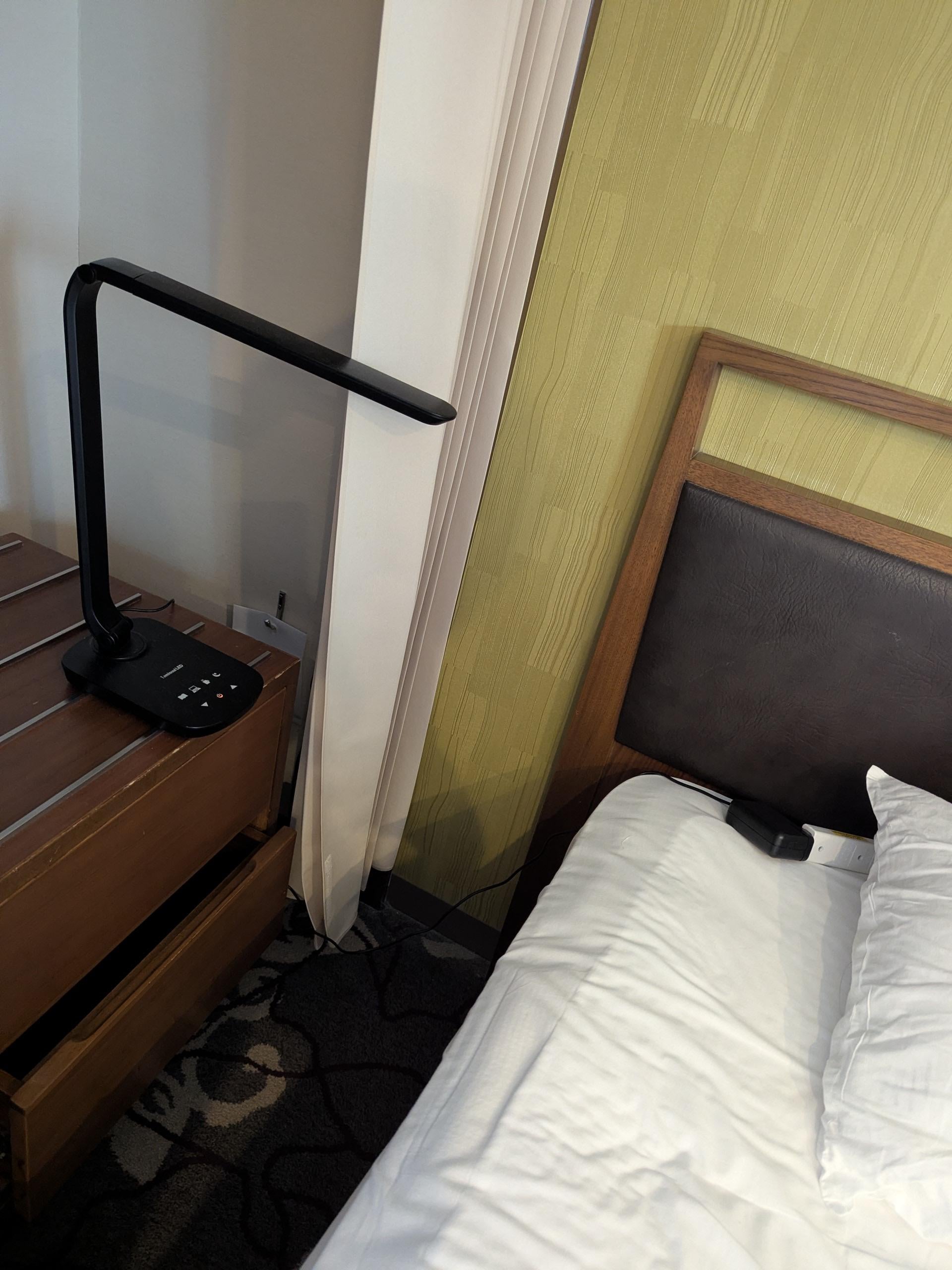  No outlet on one side of the bed, a huge inconvenience when sharing a bed. Space is so limited that the night stand was shoved inside the closet.