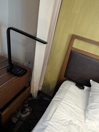 No outlet on one side of the bed, a huge inconvenience when sharing a bed. Space is so limited that the night stand was shoved inside the closet.