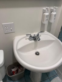 Feel like being electrocuted by this non-GFCI protected outlet (maybe the circuit is at the panel, but highly doubt it)