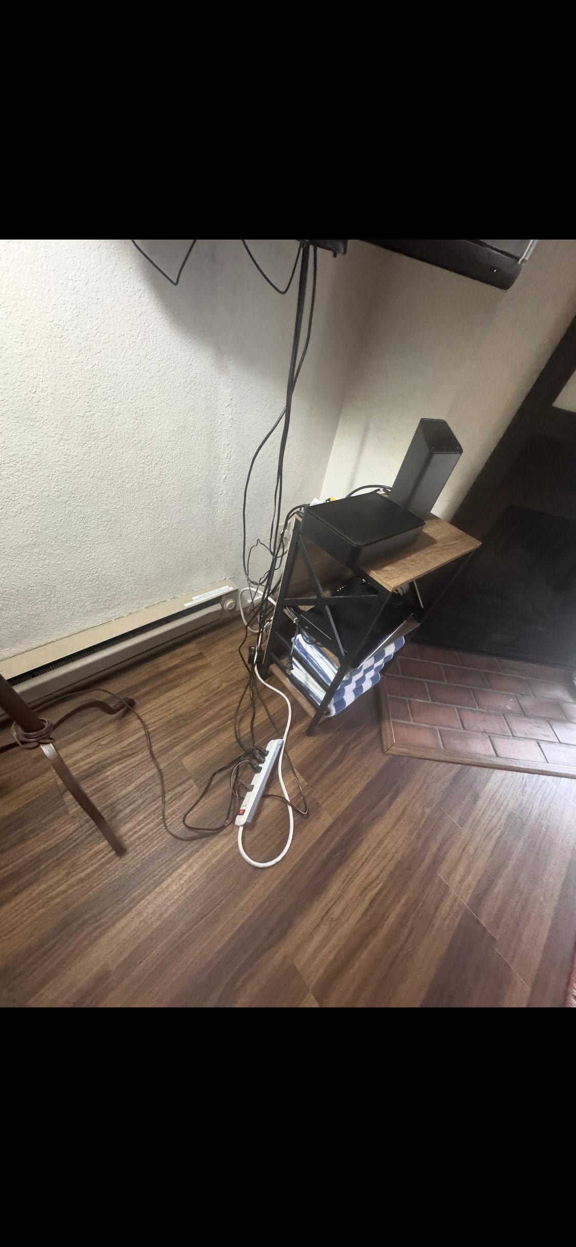 Heater next to wire. Unsafe electrical set up. 