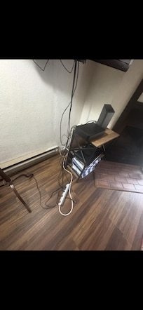 Heater next to wire. Unsafe electrical set up.