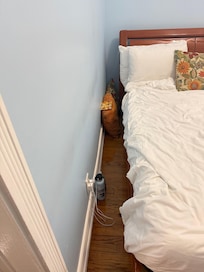 No space, night stand, or place to plug in phone.