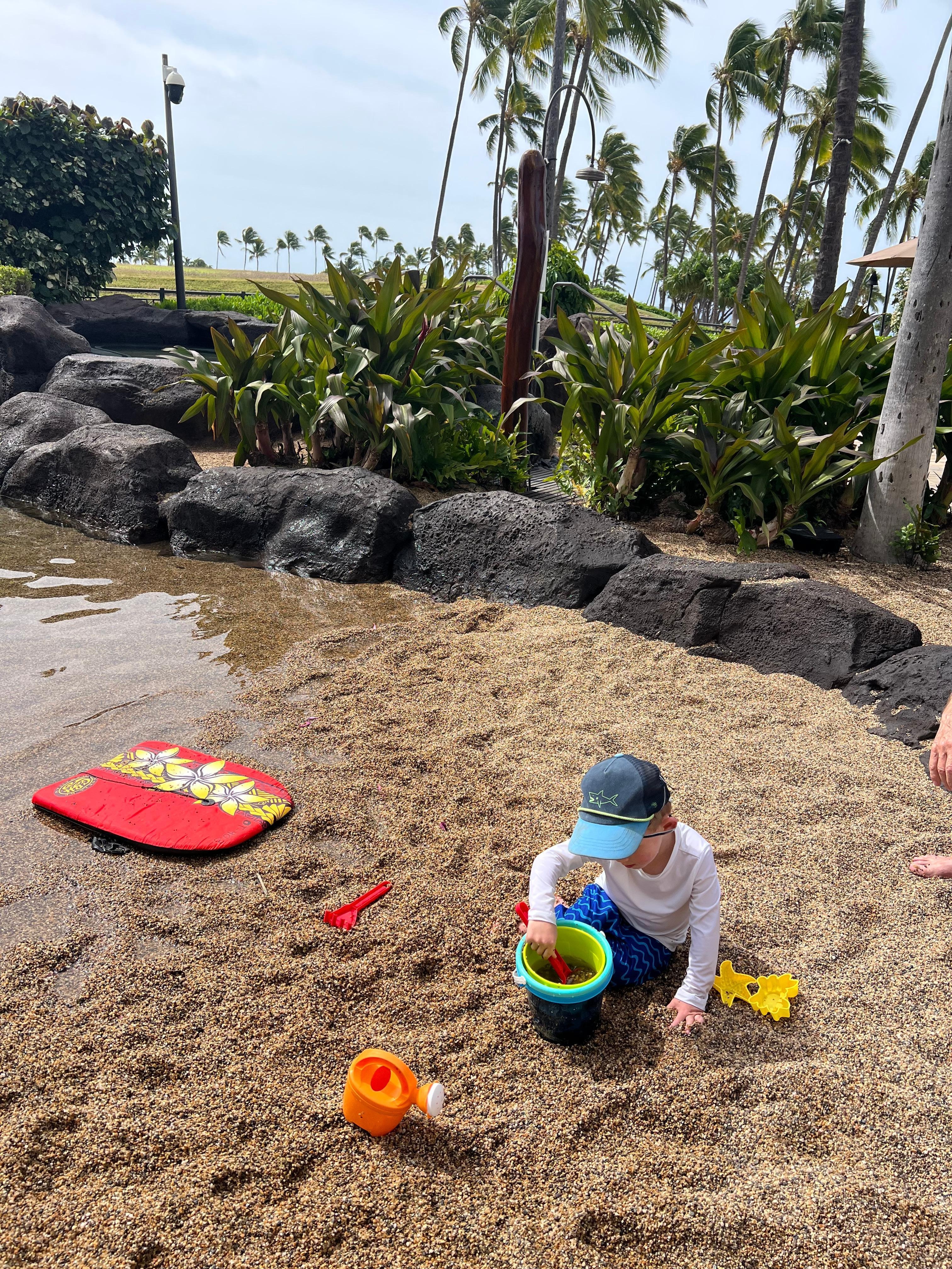 Children’s man made beach. Gravel and shallow water for so much fun!