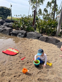 Children’s man made beach. Gravel and shallow water for so much fun!