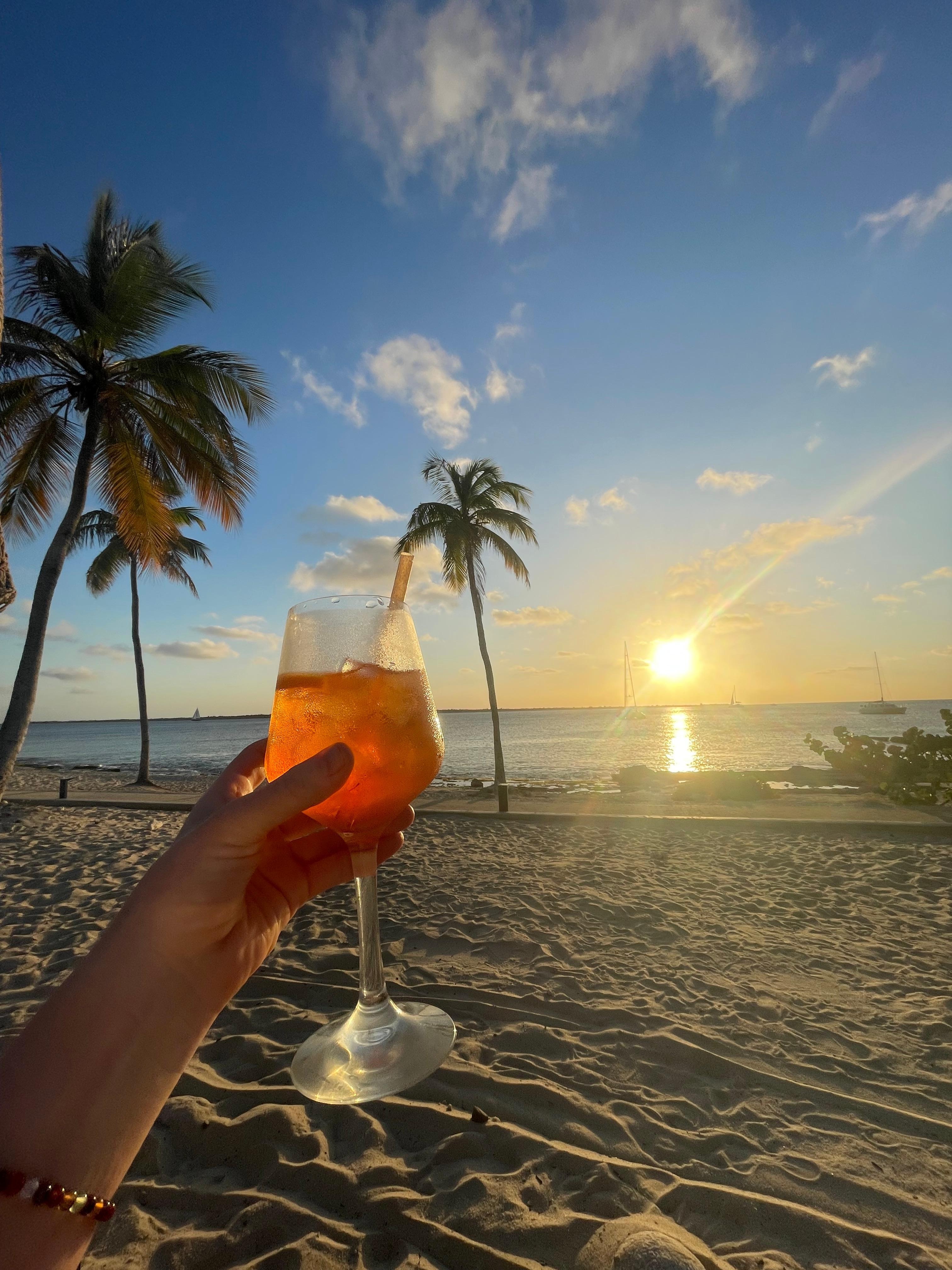 Drink on the beach at sunset
