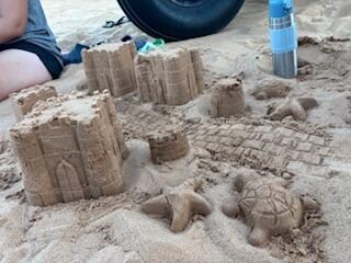 Covered sandbox area with toys 