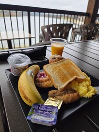 Breakfast options included hot meal, juices, waffles, pastries, and the usual fruit and cereal. The coffee station was great with mugs and to go cups as well--coffee was fantastic!