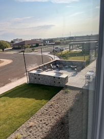 Patio with fire pit and grills. Love this!