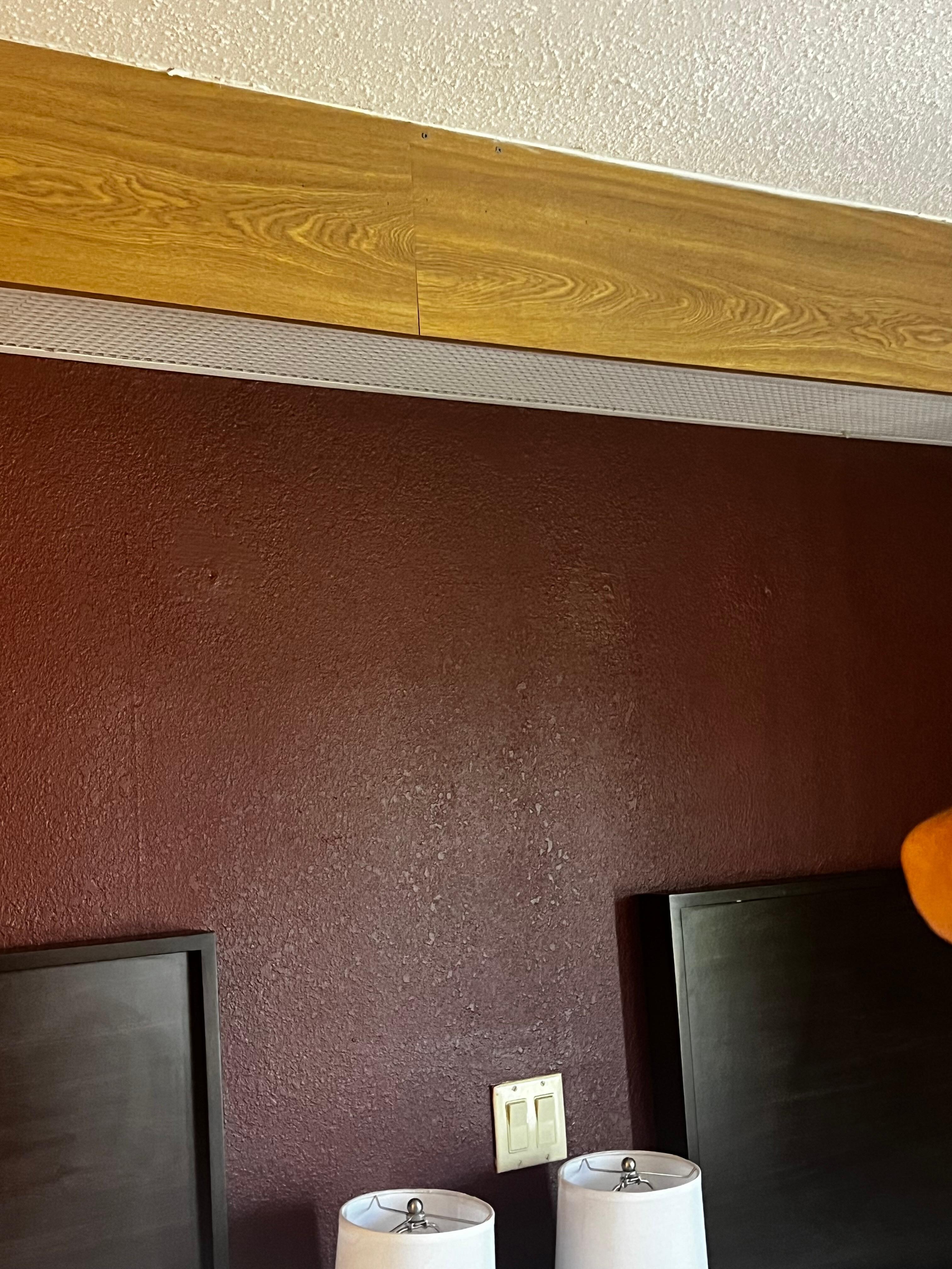 Stains on the wall behind the headboards. 