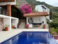 The infinity pool with the cabana