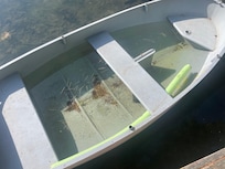 Row boat.  Full of water and dirty.