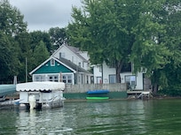 Owners house on left and boathouse on right. Picture taken from lake.