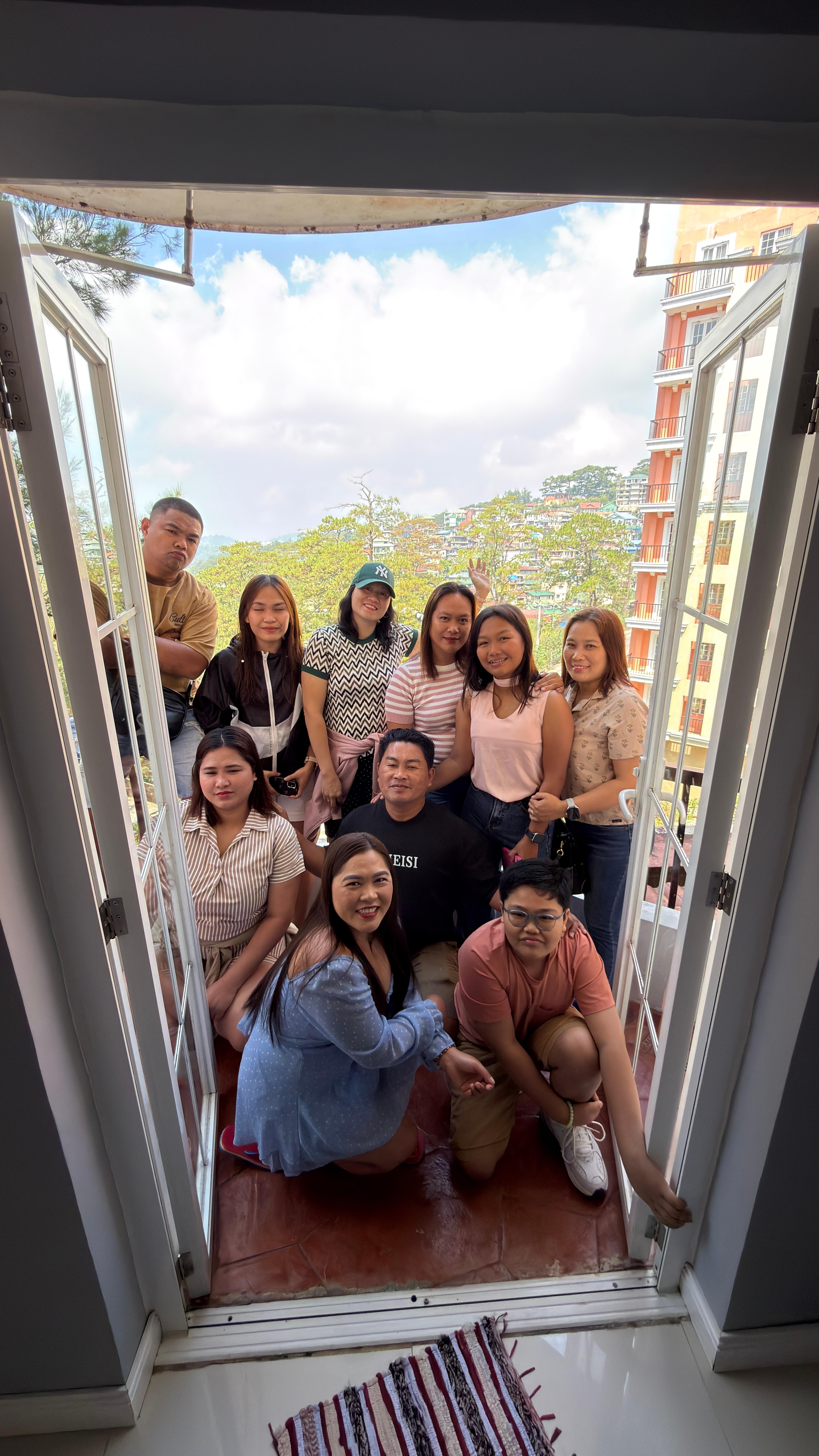 Taking picture at the balcony with my family 