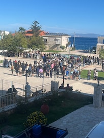The town assembled in town square for national day parade of school children and wreath laying. Enthusiastically music and marching and proud grandparents!