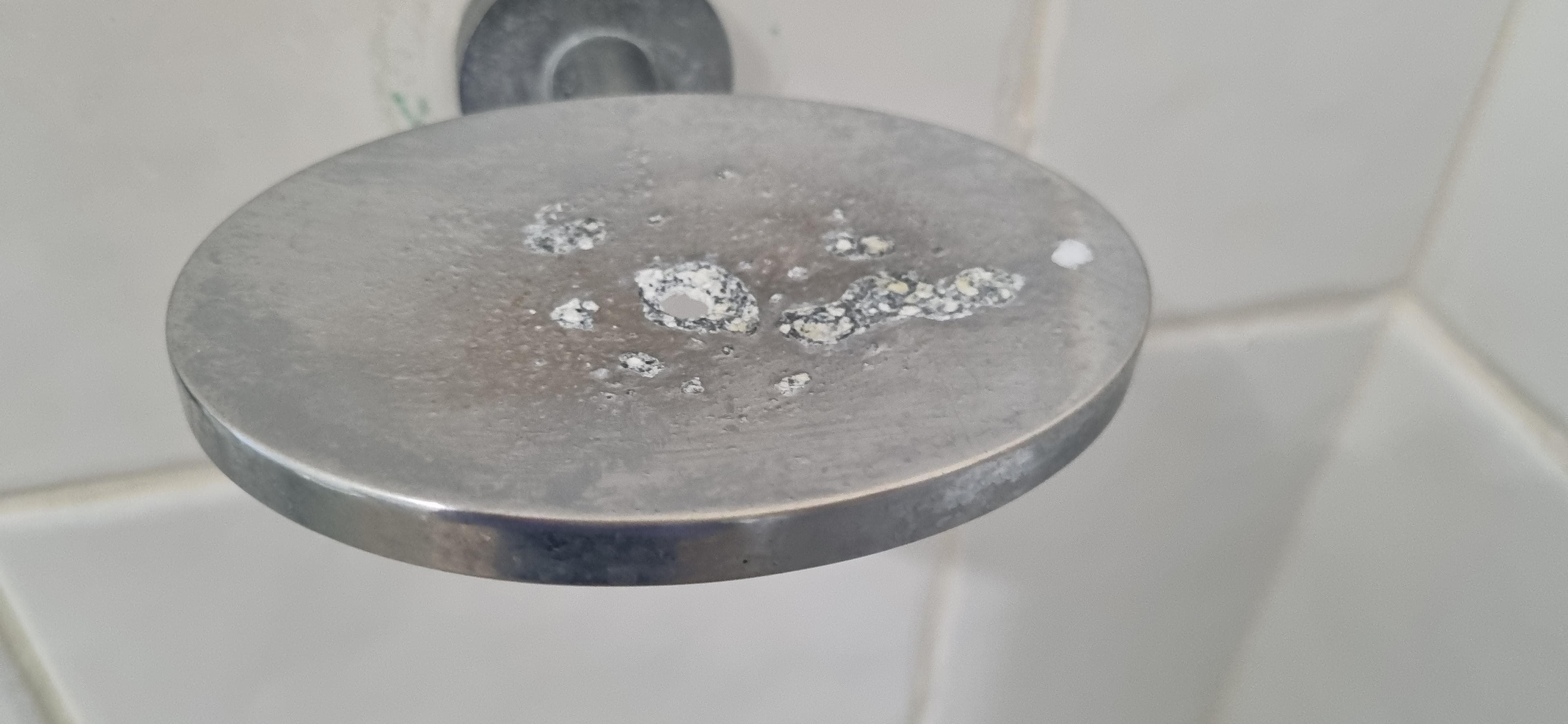 Soap residue in the shower - hadn't been cleaned.