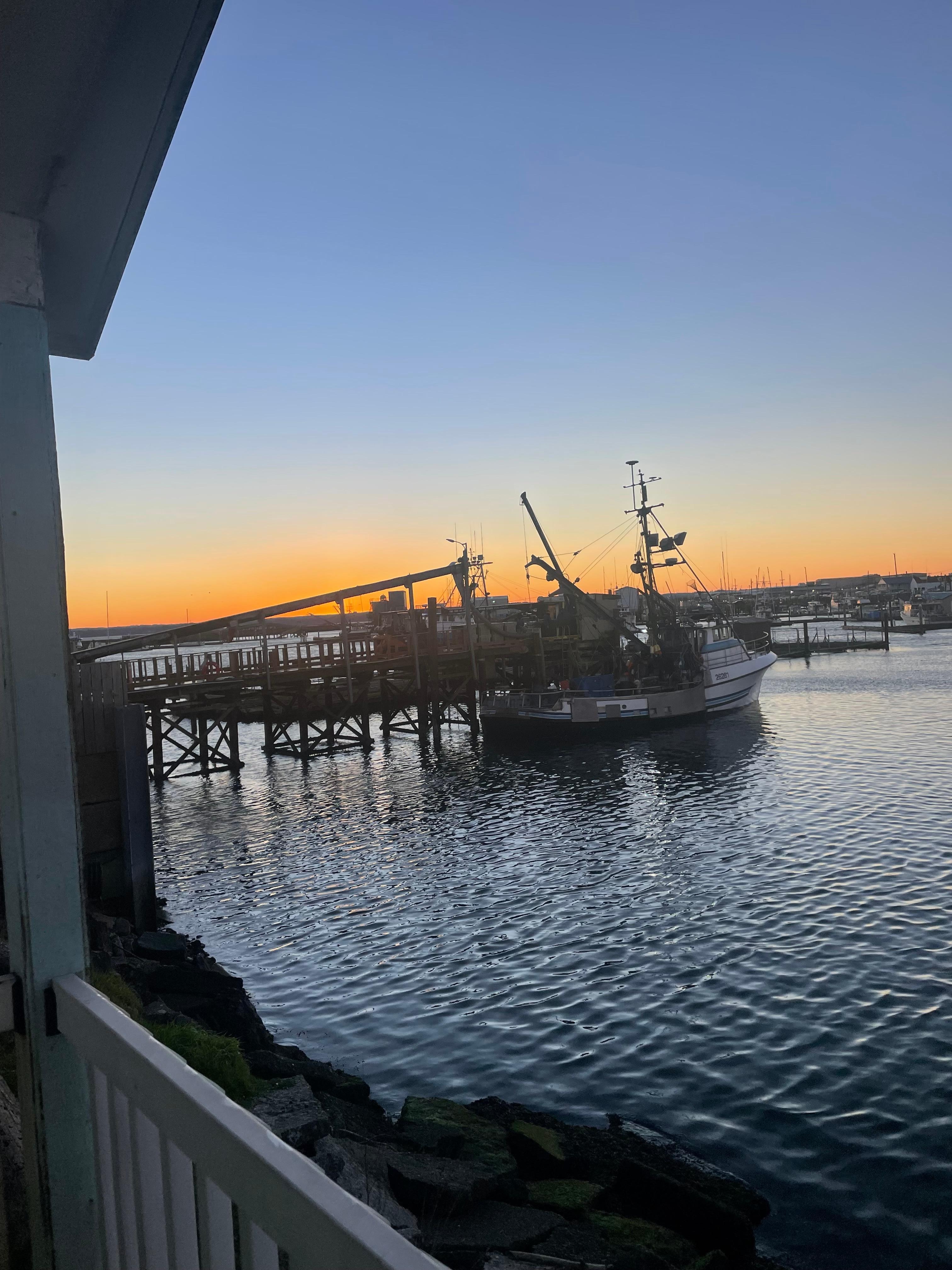 Fishing boat from our porch at sunrise.