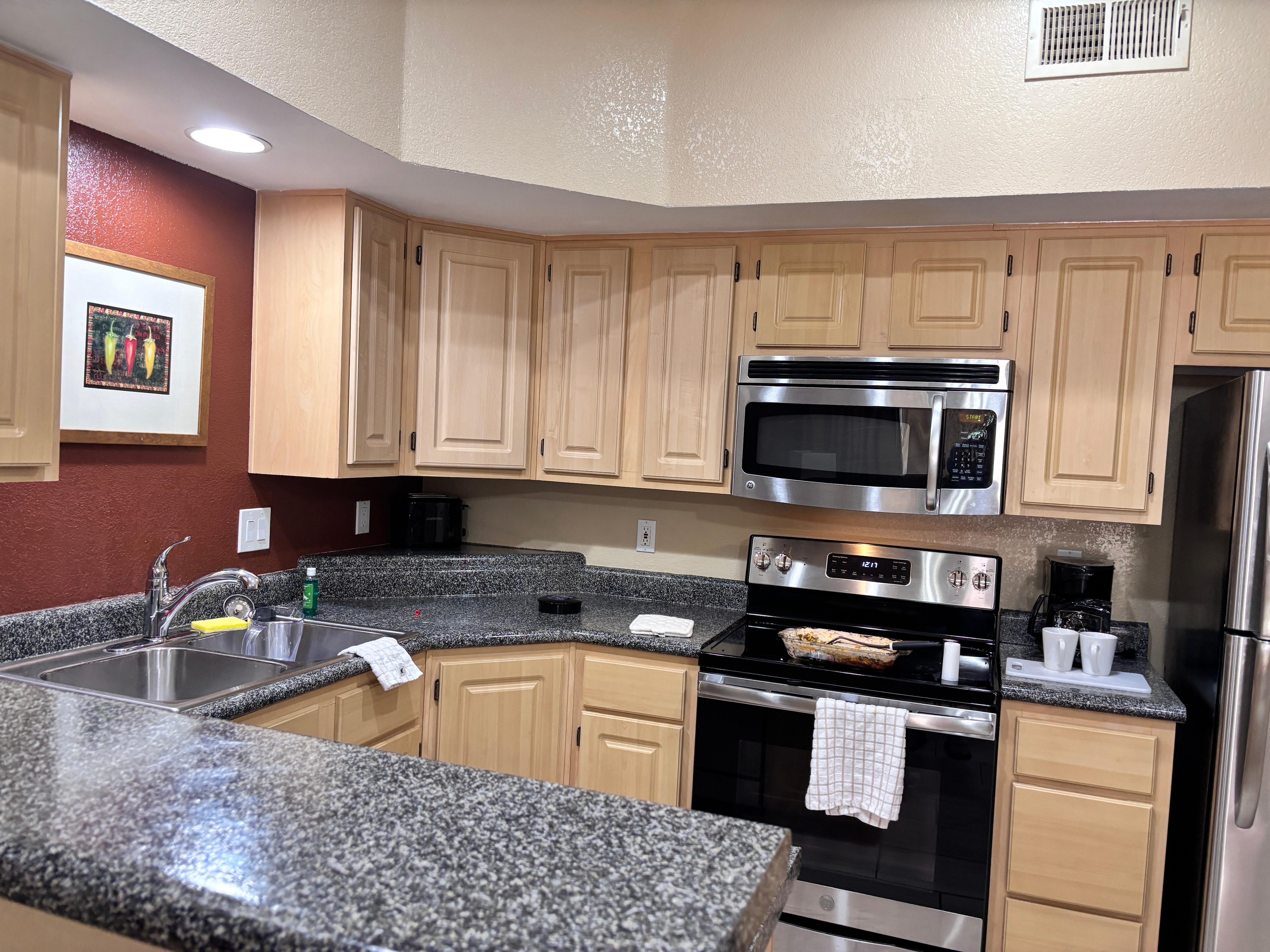 Fully equipped kitchen area (has stackable washer & dryer to the right of this pic)