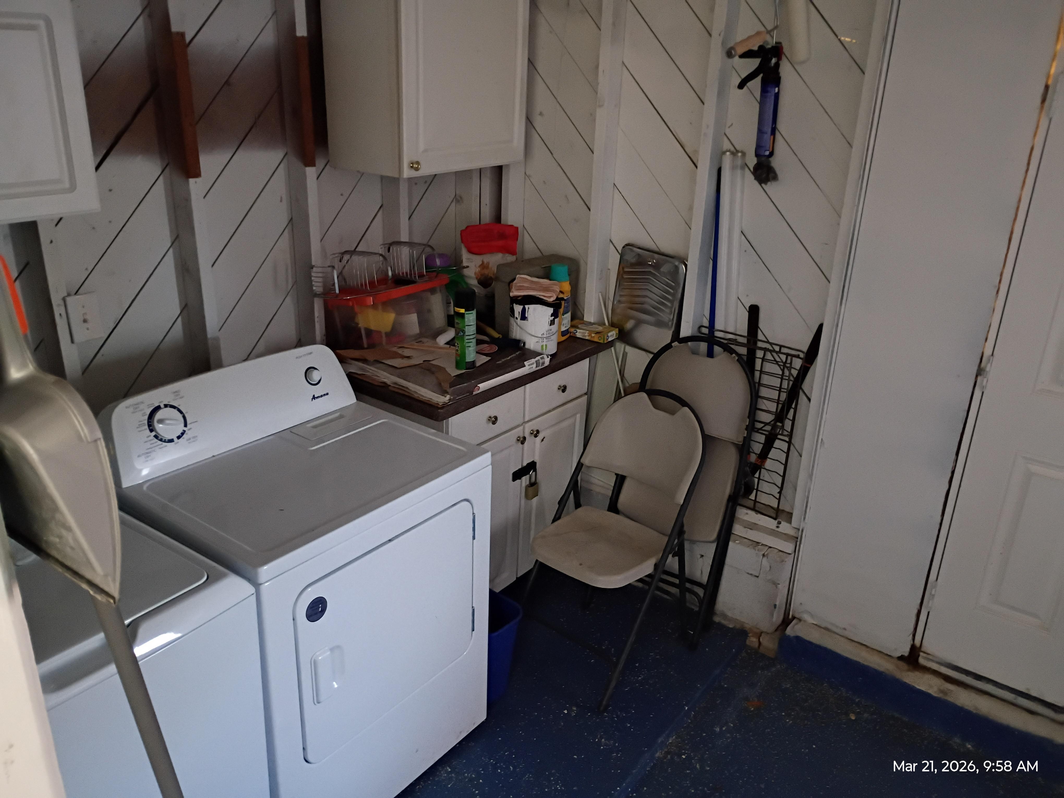 Things out in the open that are hazards to people inside garage next to the washer.