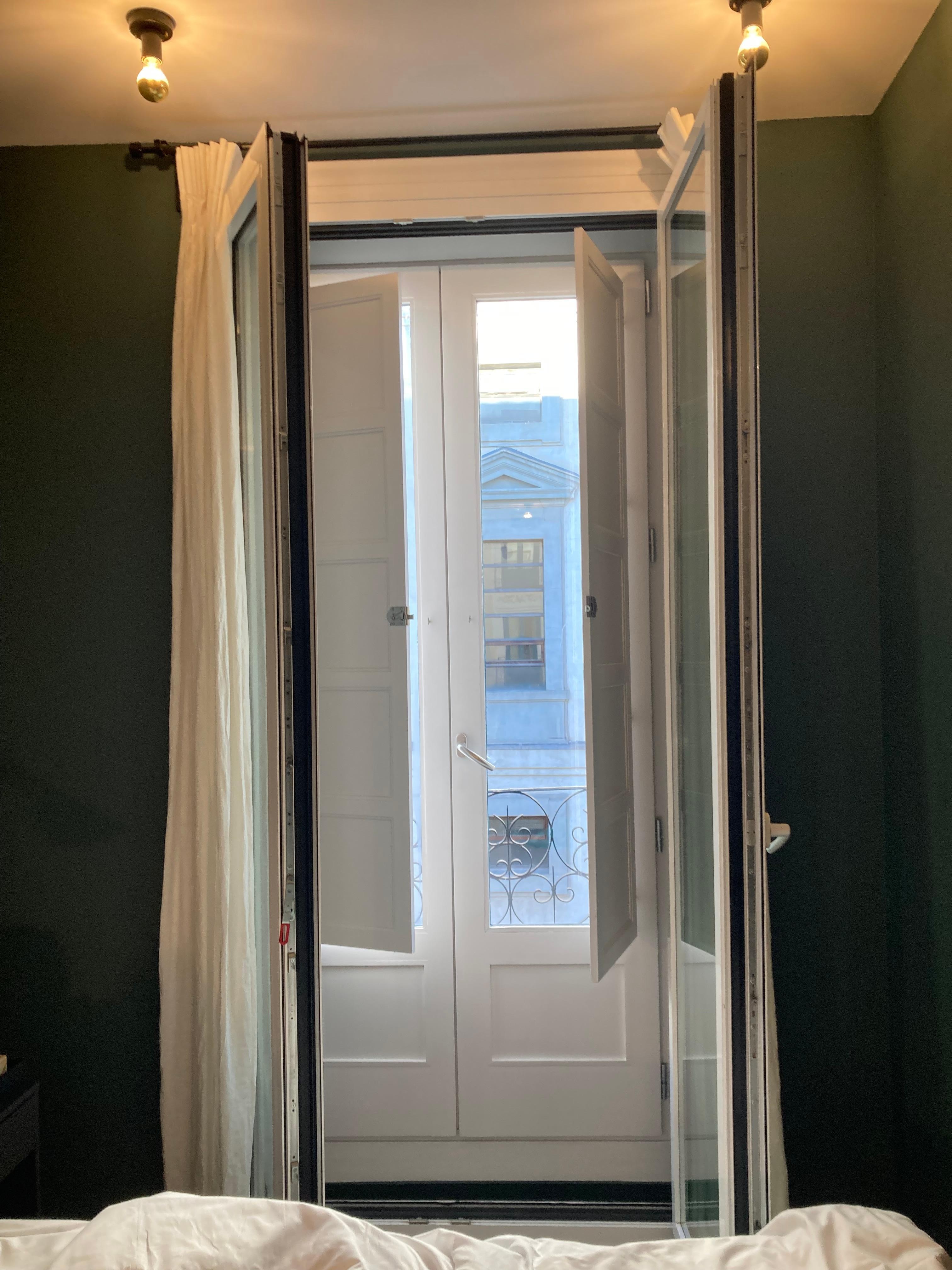 Balcony and window with shutters and sound-proof doors 