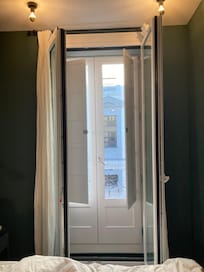 Balcony and window with shutters and sound-proof doors