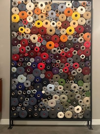This is a wall decor, hundreds of spools of wool because the hotel is a former woolen mill beautifully made into this wonderful hotel.