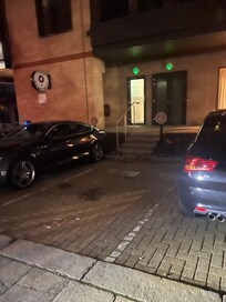 Parking spaces on side of building