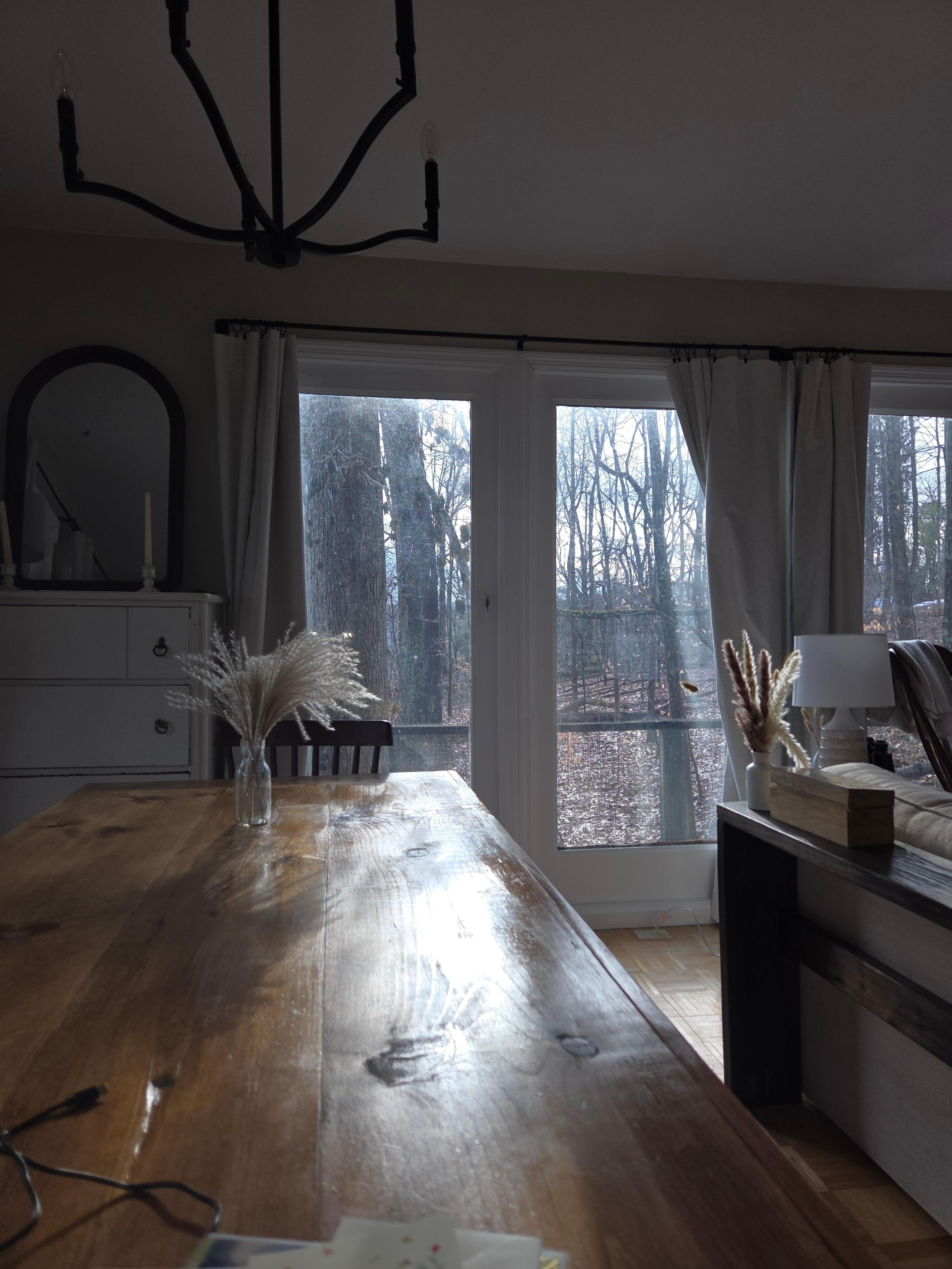 Sunset streaming in thru the floor to ceiling windows  