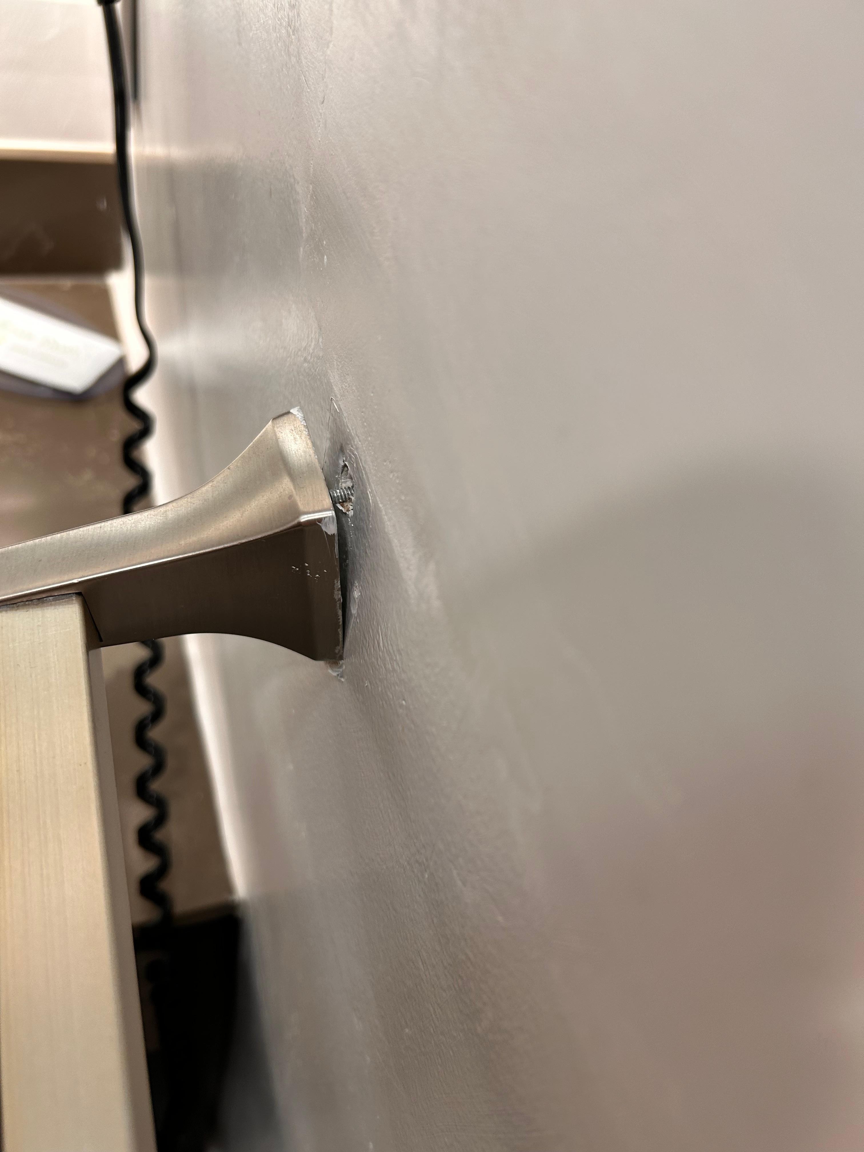 Gently put on/off your towel or it comes out of the wall