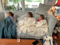 Our girls watching tv in the living room.