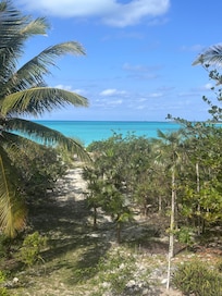 View from deck with path down to the beach. A little steep near the villa for an old guy.