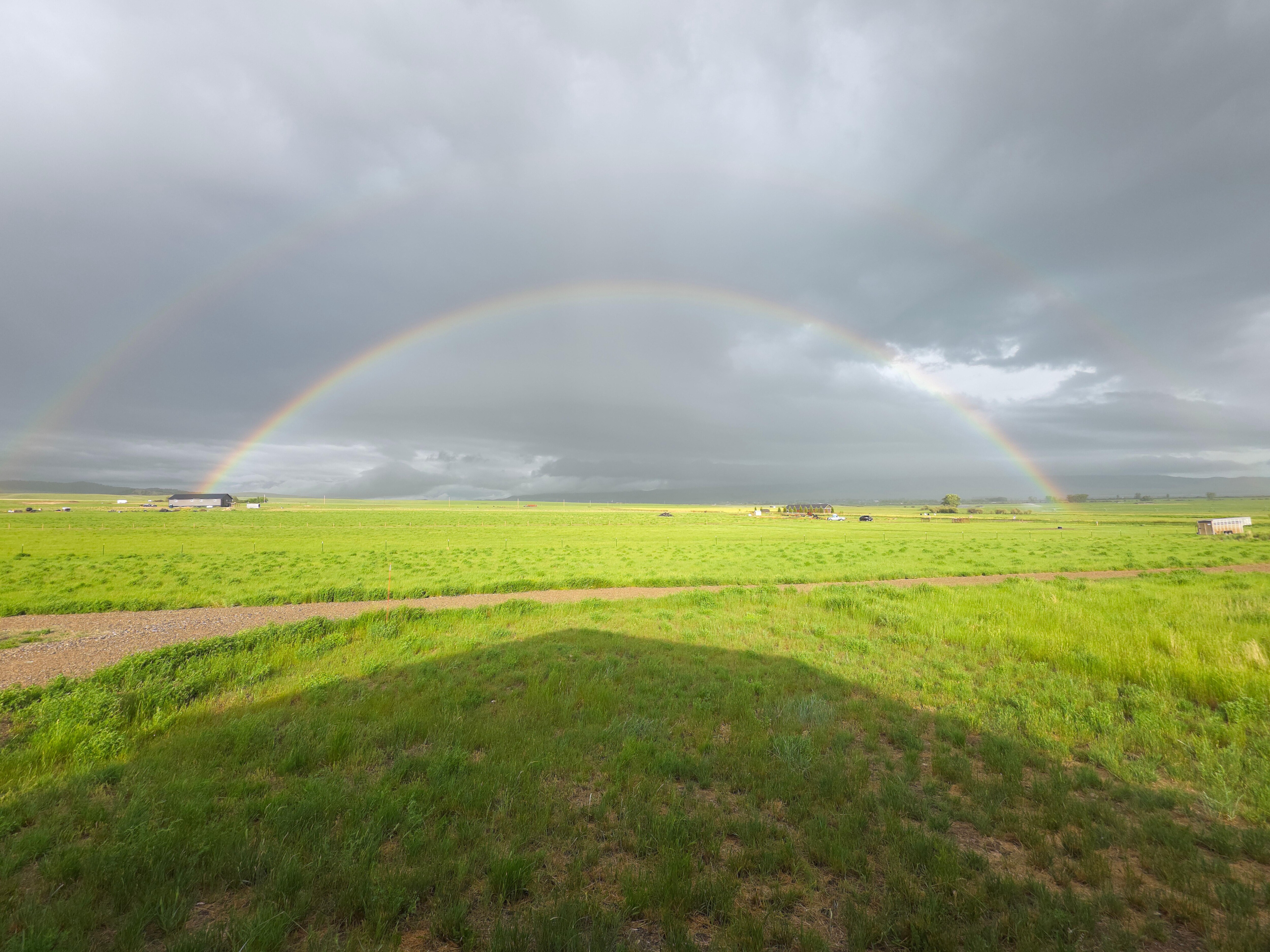 Double rainbow over the nearby ranches viewed from the Shedhorn cabins.