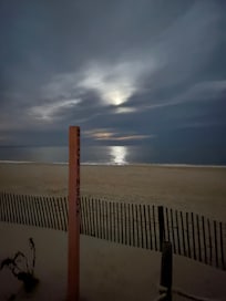 Full moon on a cloudy night at the ocean