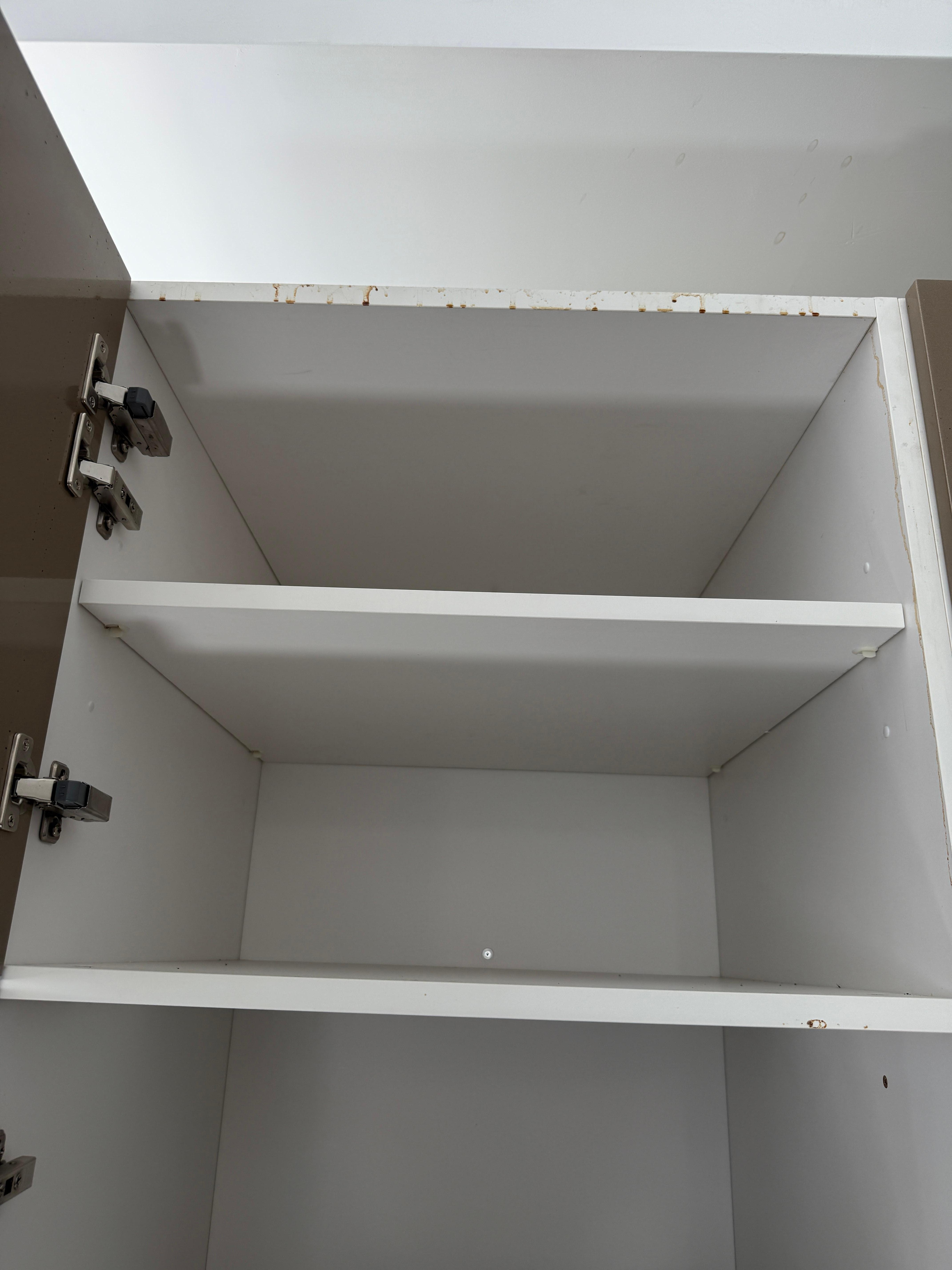 Cabinets have food splattered on them.