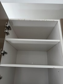 Cabinets have food splattered on them.