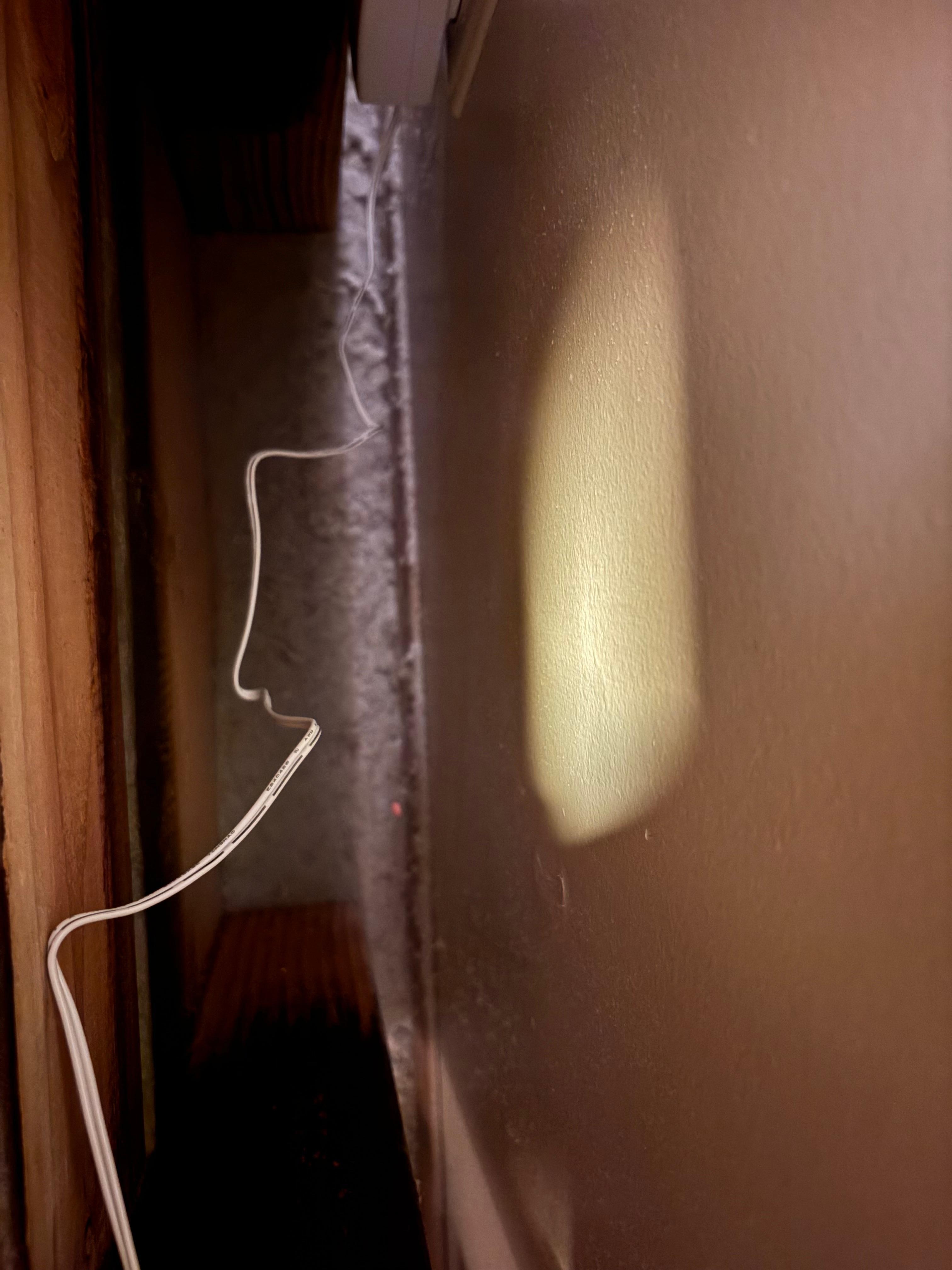 Dust on floor behind bed