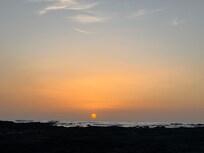 Sunset from the beach behind the house (low tide).