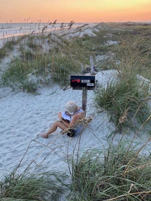 Leaving a message at the Kindred Spirit Mailbox on Bird Island.