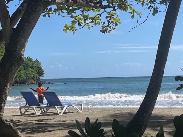 Boy dancing on the beach.