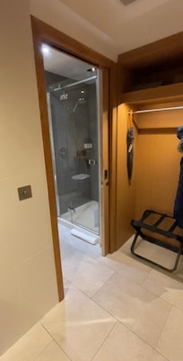 Wardrobe with Bathrobes for your use and entry into Shower and Toilet.