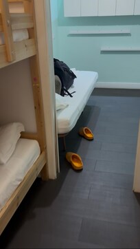Kids bunk room looking into “play space” which has been cleaned out for extra beds.